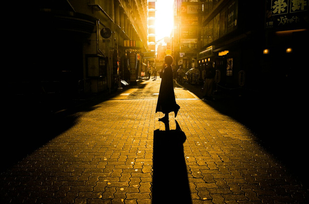 shadowy figure walking street