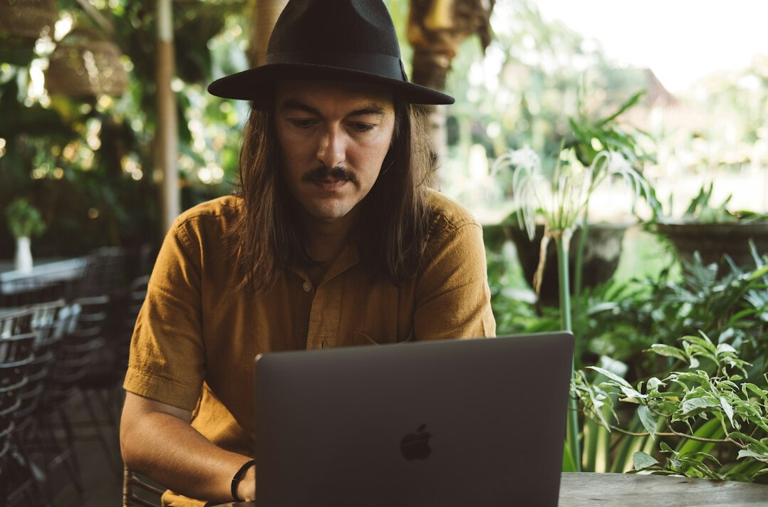 detective analyzing data on laptop